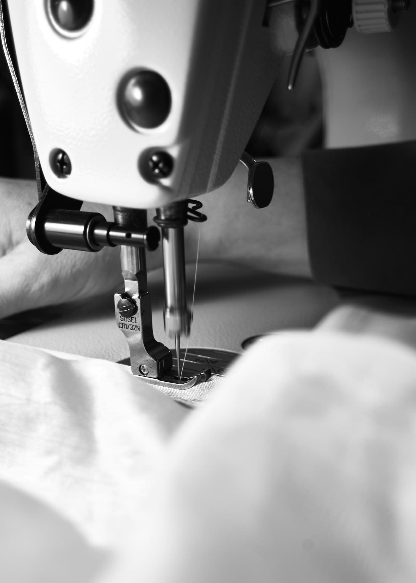 Close-up of a sewing machine needle